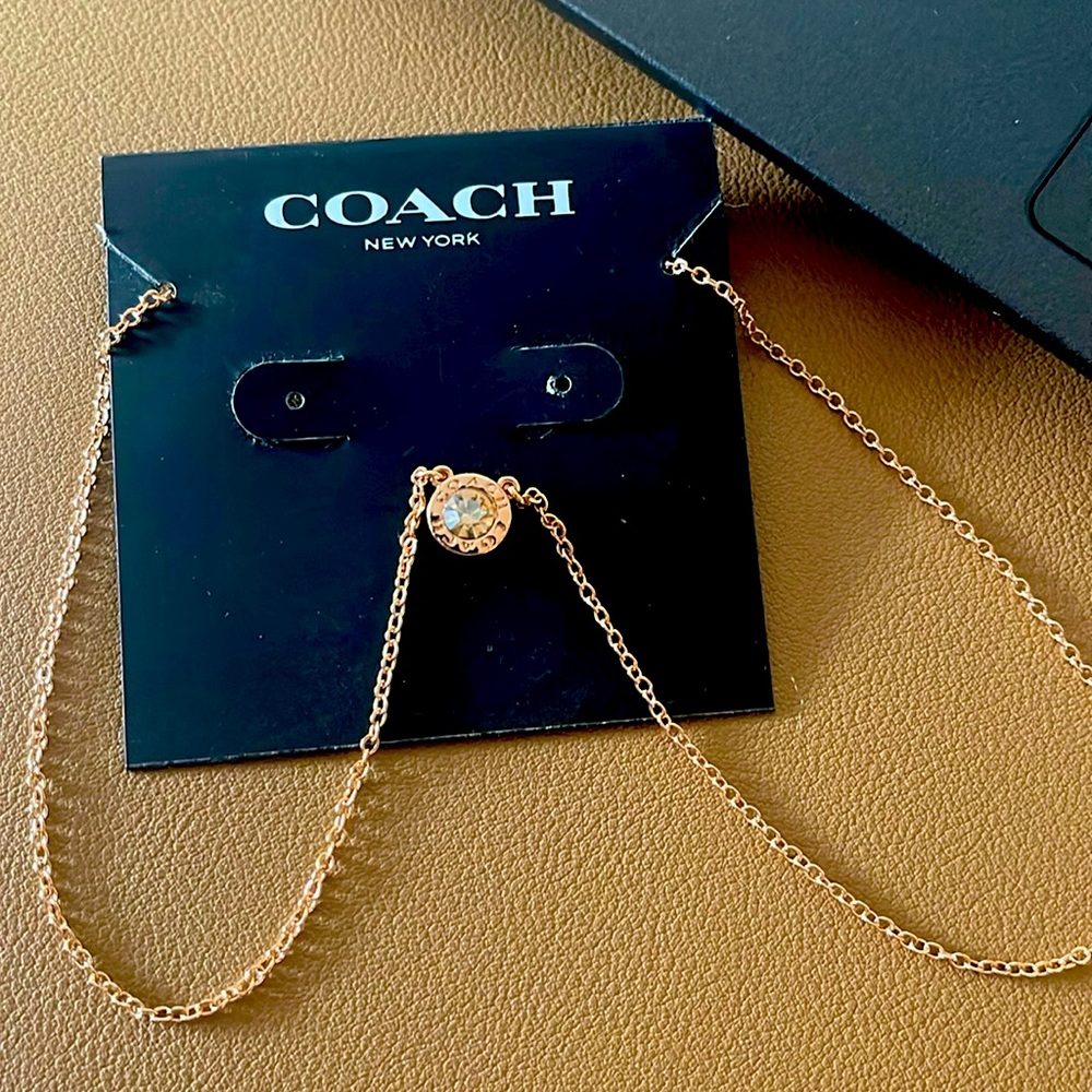 Coach women’s rose gold necklace